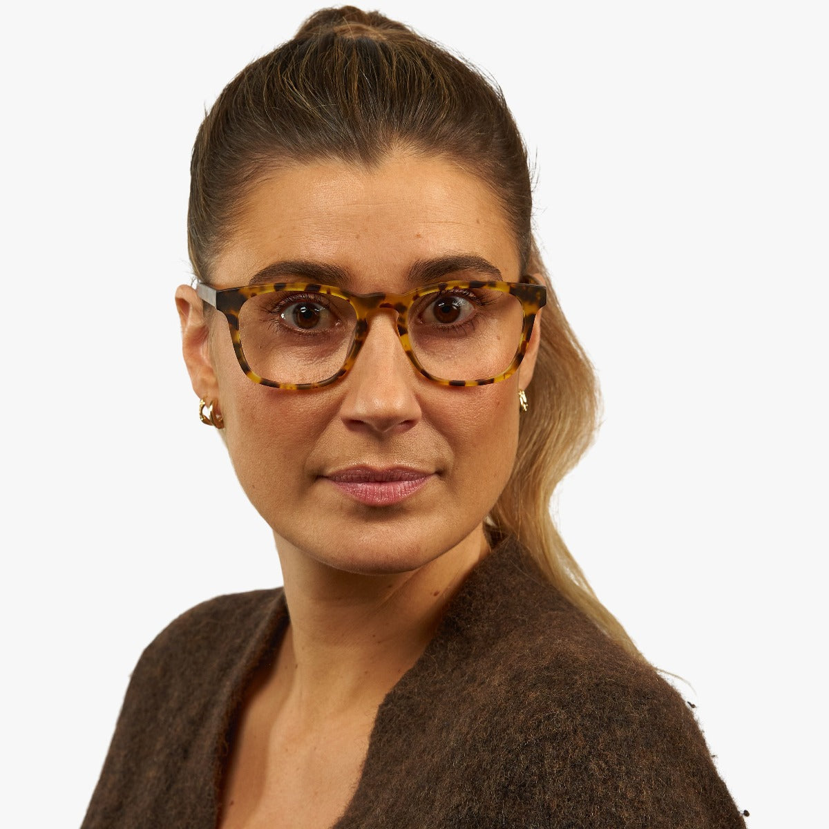 Person wearing tortoiseshell reading glasses