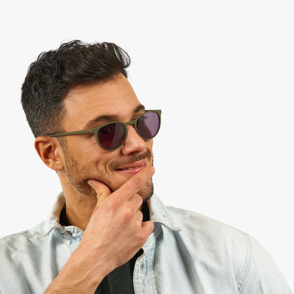 Person wearing Stockholm Dark Army sunglasses