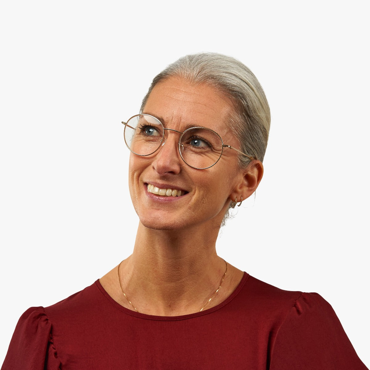Person wearing Tromsø Gold round glasses