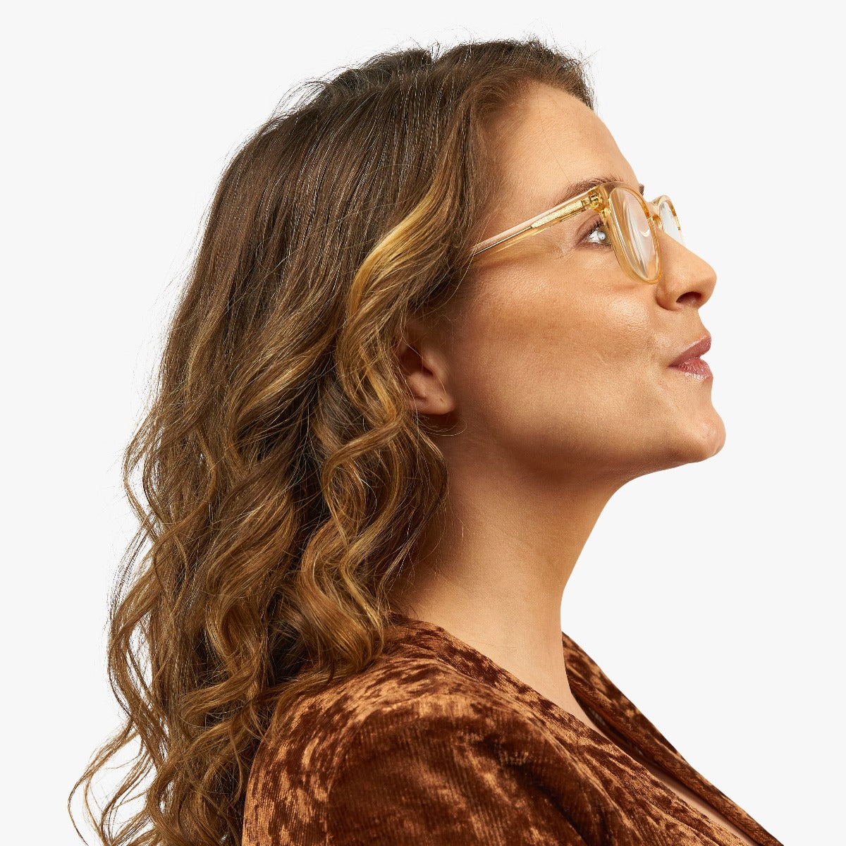 Person wearing crystal lemon reading glasses