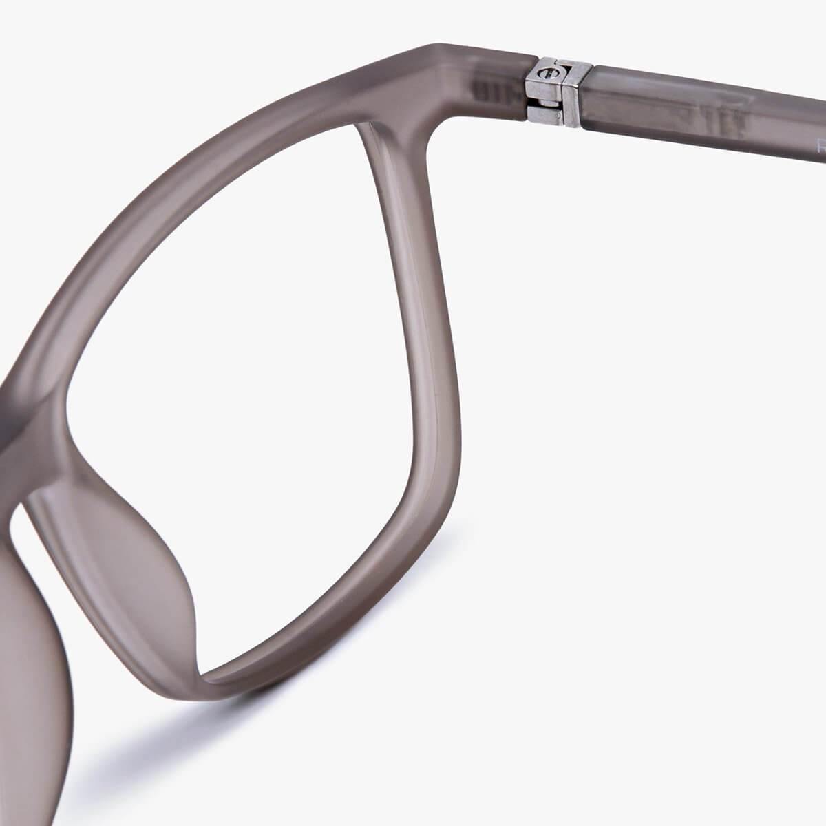 Close-up of women's grey frame glasses made of matte material